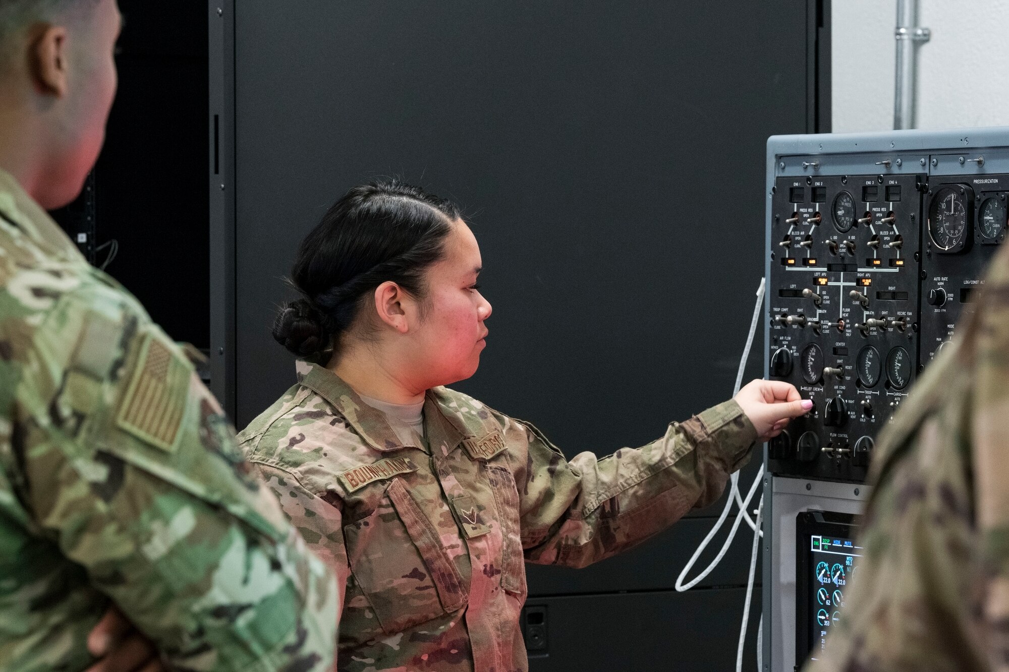 Aircraft Electrical and Environmental Systems journeyman Airman 1st Class Ketsana Bounphakdy, 305th Aircraft Maintenance Squadron, Joint Base McGuire-Dix-Lakehurst, N.J., adjusts a temperature selection switch on the C-5 Air Conditioning and Pressurization Systems Trainer Feb. 20, 2019, at the 373rd Training Squadron, Detachment 3, on Dover Air Force Base, Del. The AC & PST visually allowed Bounphakdy and other students to see what occurs when switches and knobs are moved on the flight engineer’s control panel. (U.S. Air Force photo by Roland Balik)