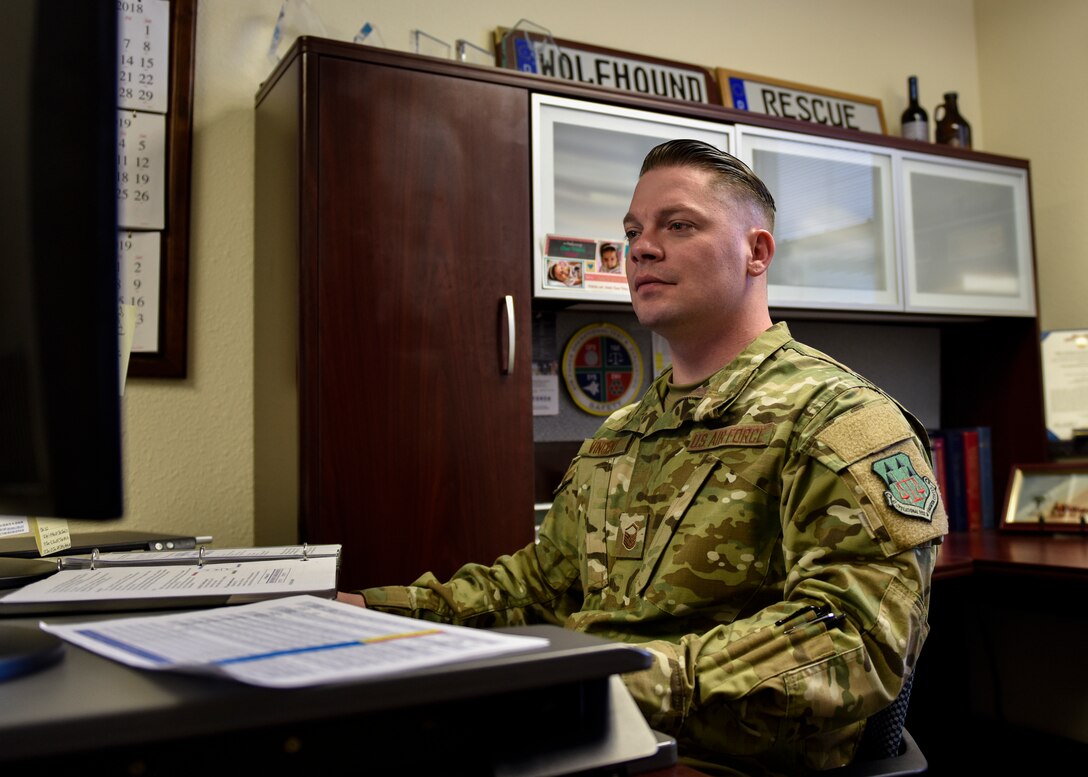 Master Sgt. Nicholas Vincent, Air Force Operational Test and Evaluation Center logistics, installations and mission support superintendent, works at his desk at Kirtland Air Force Base, N.M., March 4, 2019. Vincent was awarded the 2018 Air Force Outstanding Contracting Enlisted Member Award at the NCO level and will be flown to Orlando, Fla. in the beginning of April to receive the award. (U.S. Air Force photo by Airman 1st Class Austin J. Prisbrey)