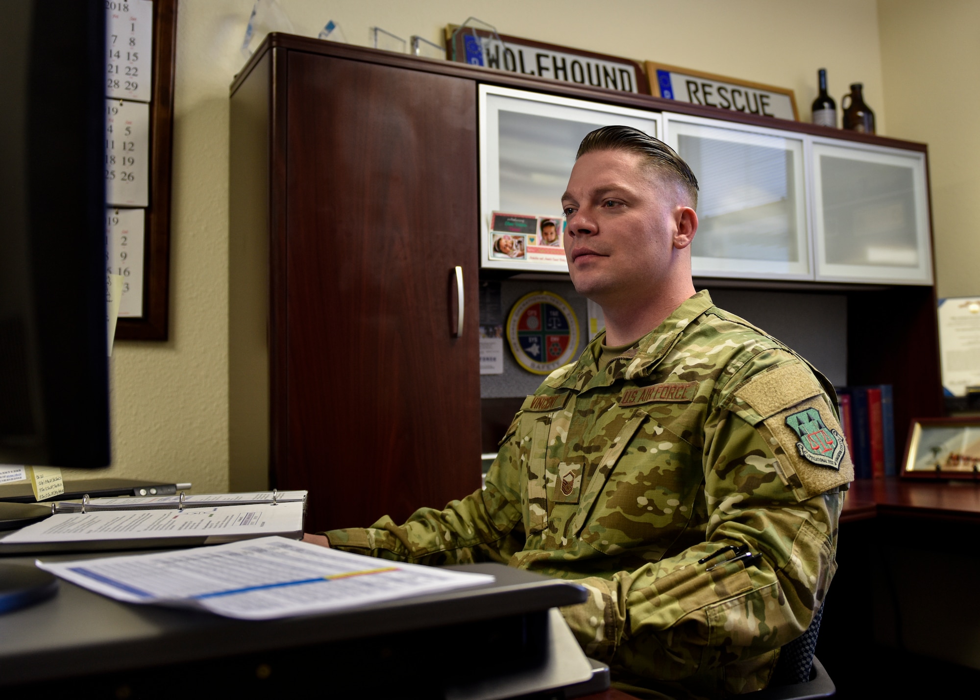 Master Sgt. Nicholas Vincent, Air Force Operational Test and Evaluation Center logistics, installations and mission support superintendent, works at his desk at Kirtland Air Force Base, N.M., March 4, 2019. Vincent was awarded the 2018 Air Force Outstanding Contracting Enlisted Member Award at the NCO level and will be flown to Orlando, Fla. in the beginning of April to receive the award. (U.S. Air Force photo by Airman 1st Class Austin J. Prisbrey)
