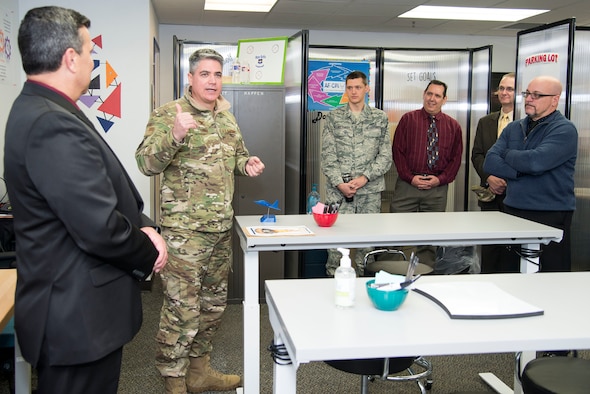 Col. Jason Lamb (2nd from left), Air Education and Training Command Director of Intelligence, Analysis, and Innovation, speaks to attendees at the grand opening of the command's "Fire Pit" workshop March 5, 2019, at Joint Base San Antonio-Randolph, Texas.  Mirrored to the wing level Spark Cell variant, the AETC Fire Pit is the major command’s effort to invigorate innovation and support grassroots initiatives in a collaborative space designed to incubate and accelerate innovation initiatives and build a network with industry, academia, and the Department of Defense to provide rapid solutions to the needs of the warfighter.  (U.S. Air Force photo by Sean Worrell)