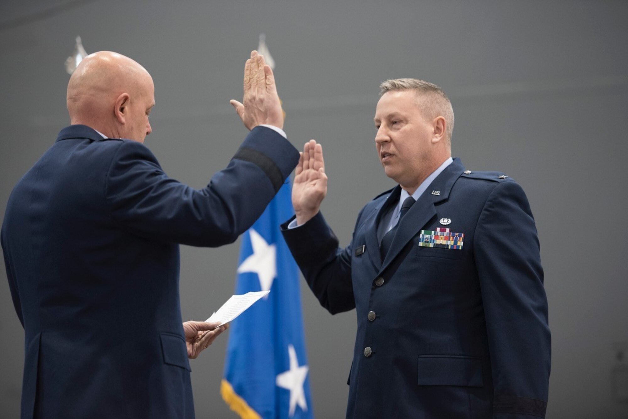 Brig. Gen. Ray Shepard takes the oath of office, administered by retired Maj. Gen. Eric Vollmecke, during Shepard’s promotion ceremony at the 167th Airlift Wing, March 3, 2019. Shepard served as a Staff Judge Advocate at the 167th AW for approximately 10 years before moving on to serve as the State Staff Judge Advocate for the West Virginia Air National Guard and currently as the Chief of Staff of the WVANG. (U.S. Air National Guard photos by Tech. Sgt. Michael Dickson)
