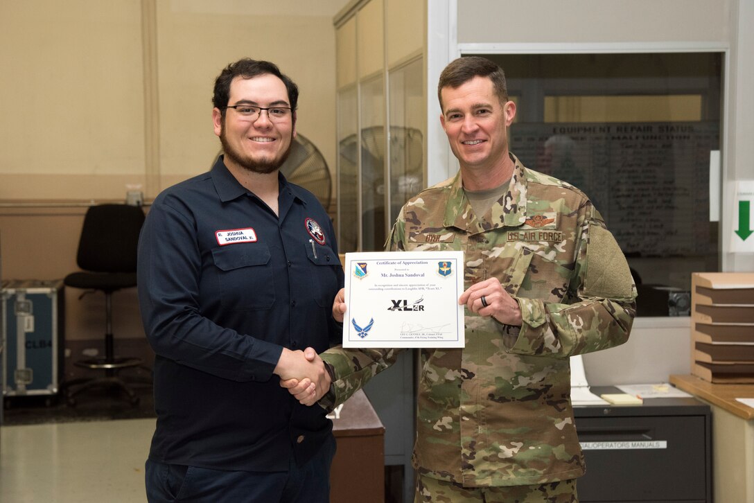 Joshua Sandoval, 47th Maintenance Directorate aerospace ground equipment repair technician, was chosen by wing leadership to be the “XLer” of the week, for the week of Feb. 25, 2019, at Laughlin Air Force Base, Texas. The “XLer” award, presented by Col. Lee Gentile, 47th Flying Training Wing commander, is given to those who consistently make outstanding contributions to their unit and the Laughlin mission. (U.S. Air Force photo by Senior Airman Benjamin N. Valmoja)