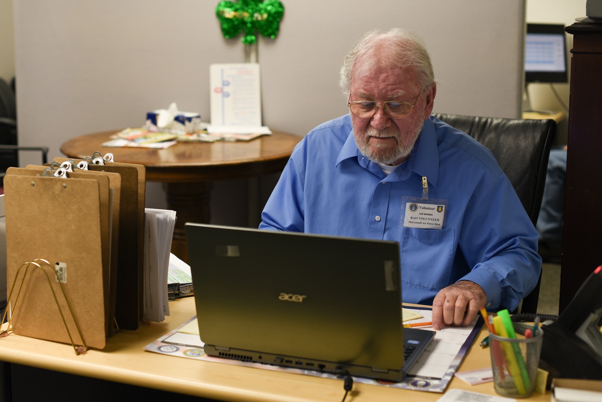 MCCONNELL AIR FORCE BASE, Kan.-- Len Barnes, volunteer tax accountant, sits at the tax center front desk, March 5, 2019, at McConnell Air Force Base, Kan. Barnes is one of the 14 volunteers who endured 40 hours of training to become a tax center volunteer. (U.S. Air Force photo by Airman 1st Class Alexi Myrick)