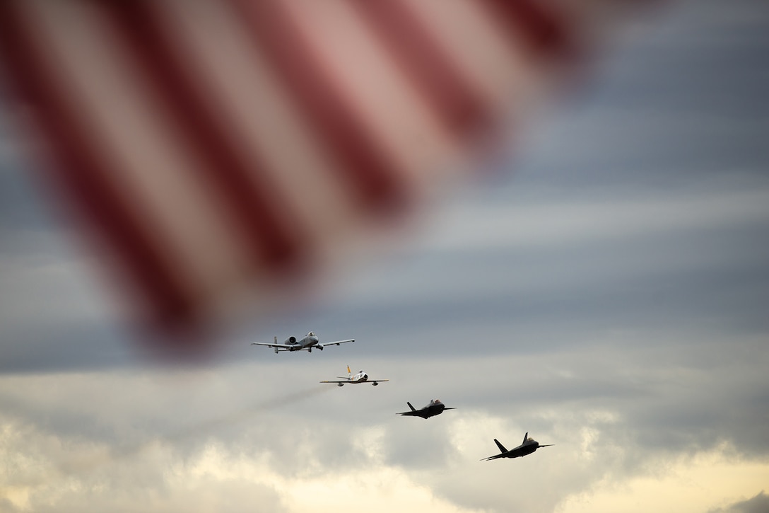 Aircraft fly in formation.