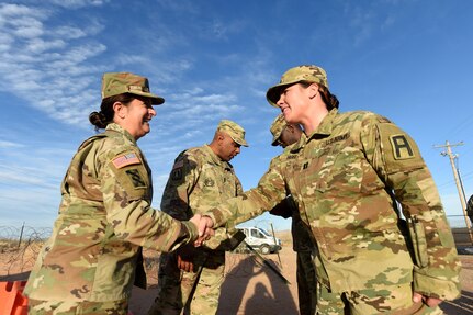 Brig. Gen. Kris A. Belanger, Commanding General, 85th U.S. Army Reserve Support Command, presents a command coin to Capt. Andrea Fasel, Alpha Team officer-in-charge, 3rd Battalion, 345th Regiment, 85th U.S. Army Reserve Support Command, operationally controlled by First Army’s 5th Armored Brigade, during a command site visit, there, at Fort Bliss, Texas, March 1-3, 2019.