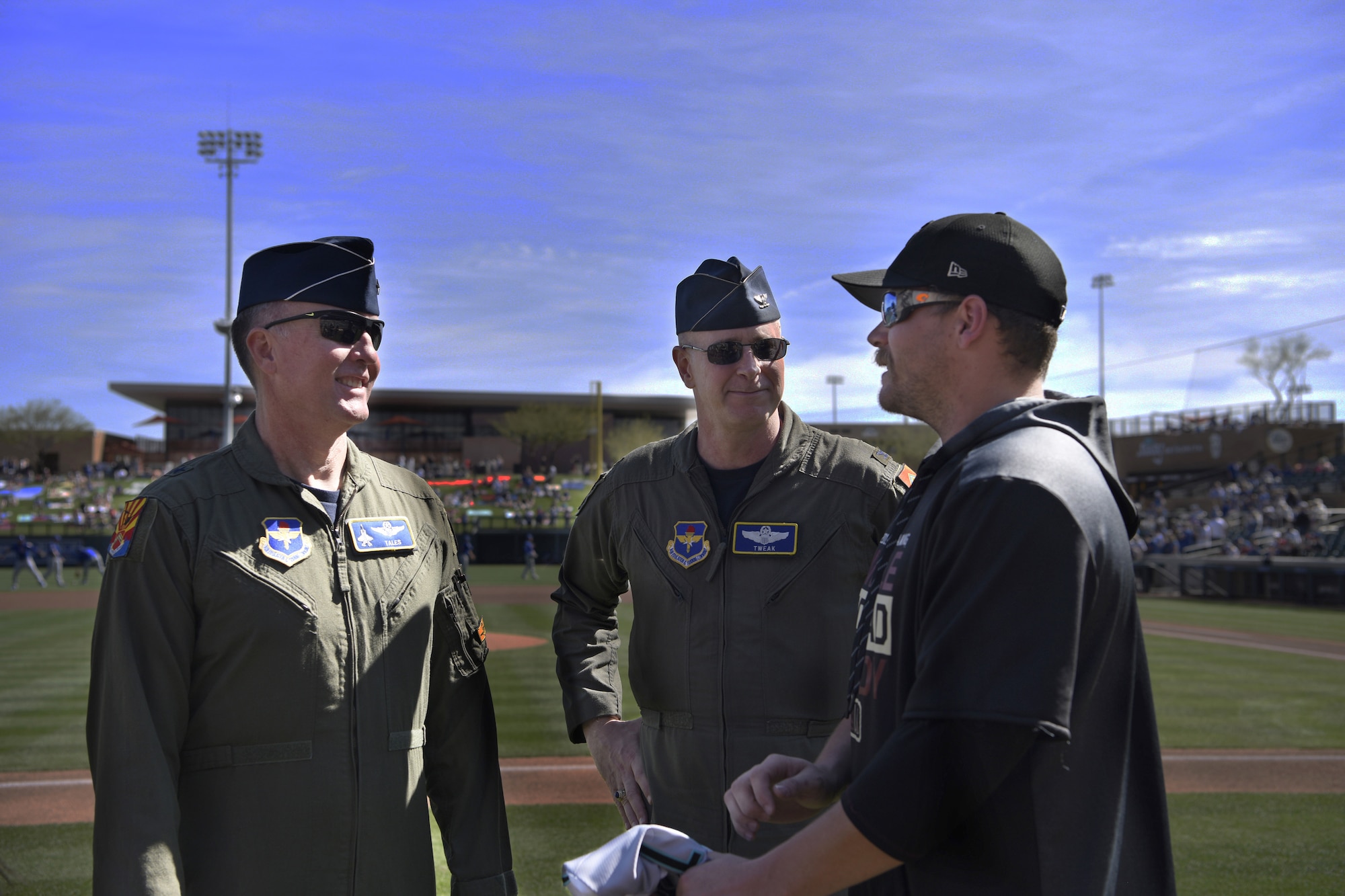 Brig. Gen. Todd Canterbury, 56th Fighter Wing commander, and Col. Michael Richardson, 56th FW vice commander, speak with a team member at Salt River Fields in Scottsdale, Ariz., March 1, 2019.