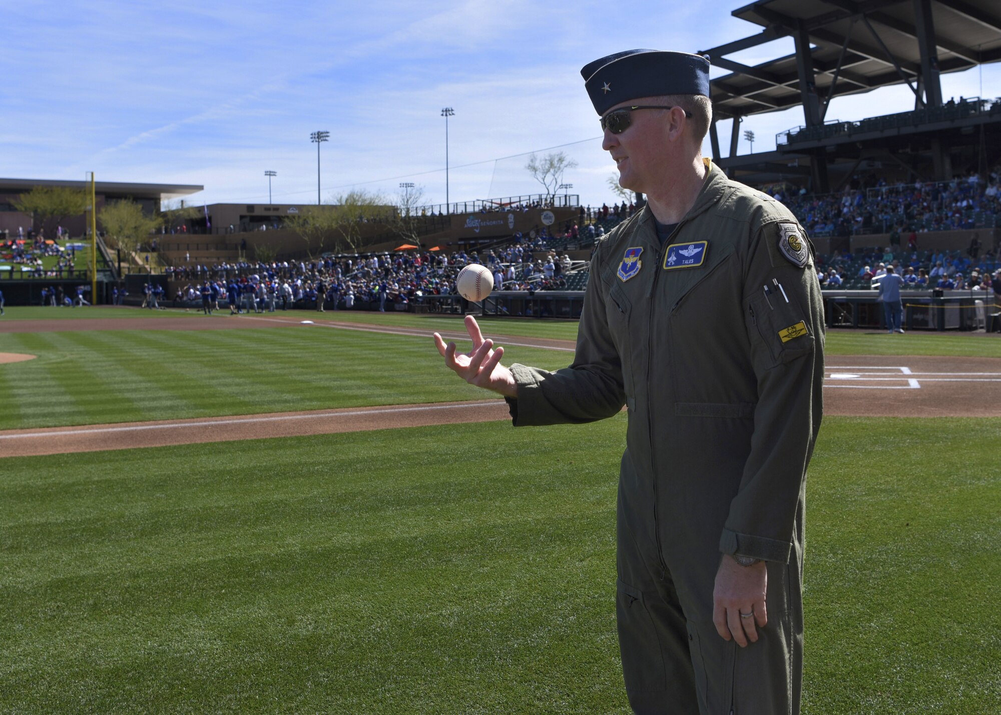 Brig. Gen. Todd Canterbury, 56th Fighter Wing commander, throws a baseball in the air at Salt River Fields in Scottsdale, Ariz., March 1, 2019.