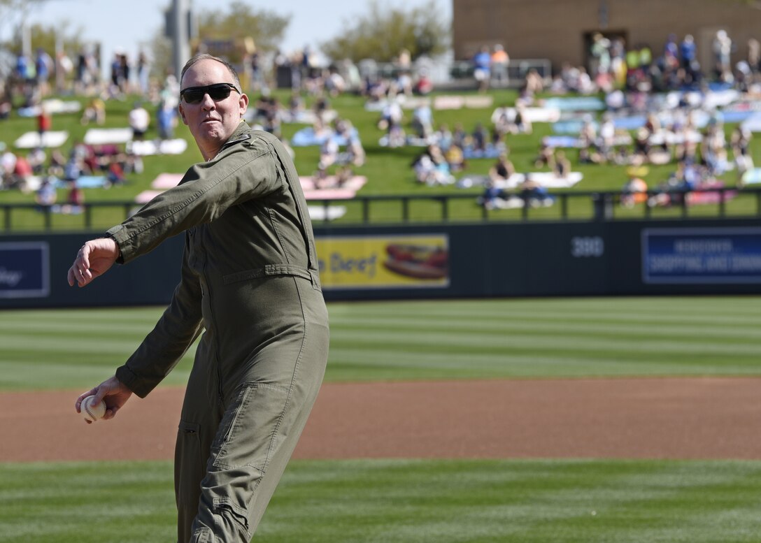 Brig. Gen. Todd Canterbury, 56th Fighter Wing commander, winds up for the first pitch at the Arizona Diamondbacks vs. Chicago Cubs game at Salt River Fields in Scottsdale, Ariz., March 1, 2019.