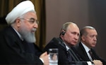 From left, Presidents Hassan Rouhani, Vladimir Putin, and Recep Erdogan during news conference following meeting in Sochi, February 14, 2019.