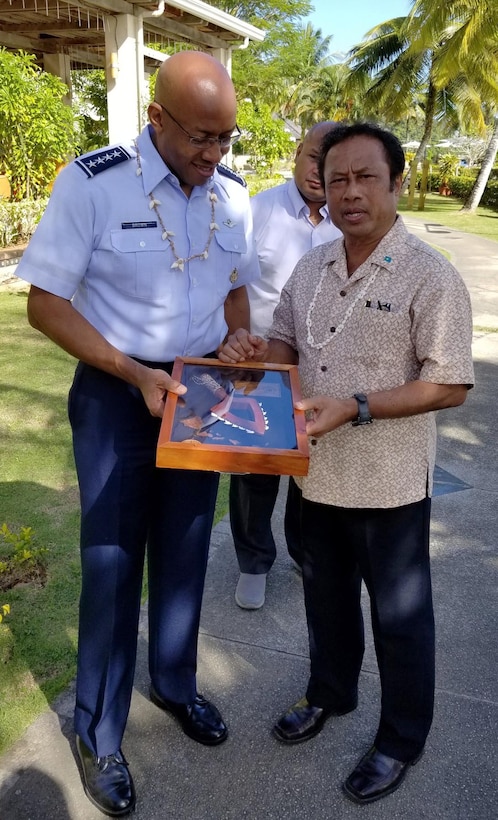 President Tommy E. Remengesau, Jr., President of the Republic of Palau, presents a gift to Gen. CQ Brown, Jr., Pacific Air Forces commander, during a visit to the Republic of Palau, Feb. 19, 2019.