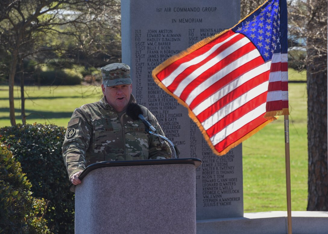 Honor Guard Airman placing a wreath during a ceremony