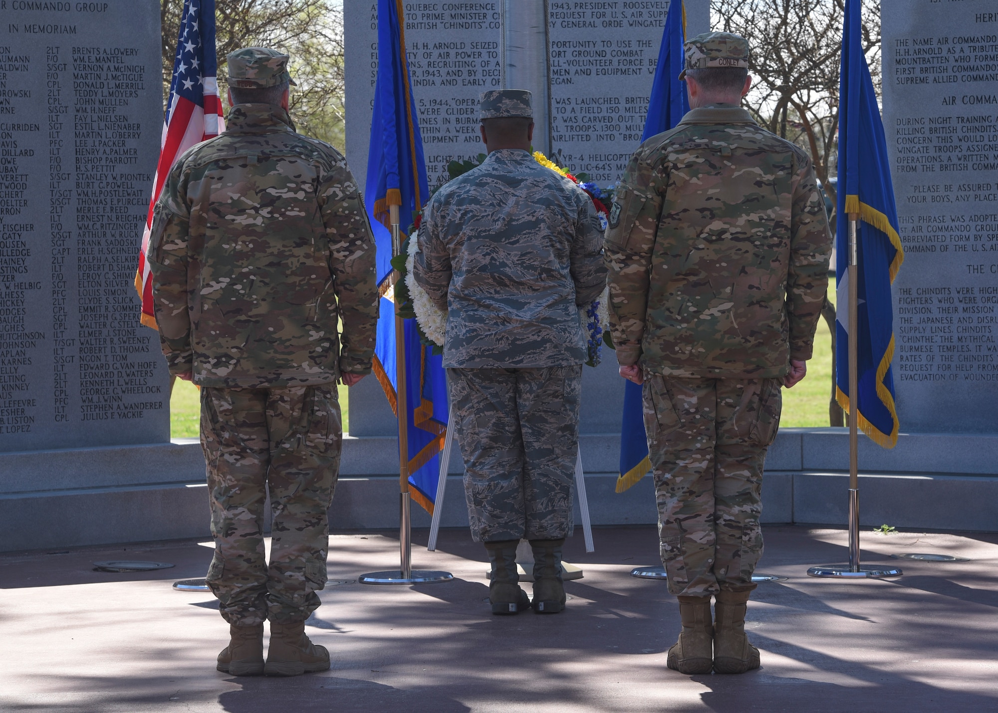 Honor Guard Airman placing a wreath during a ceremony