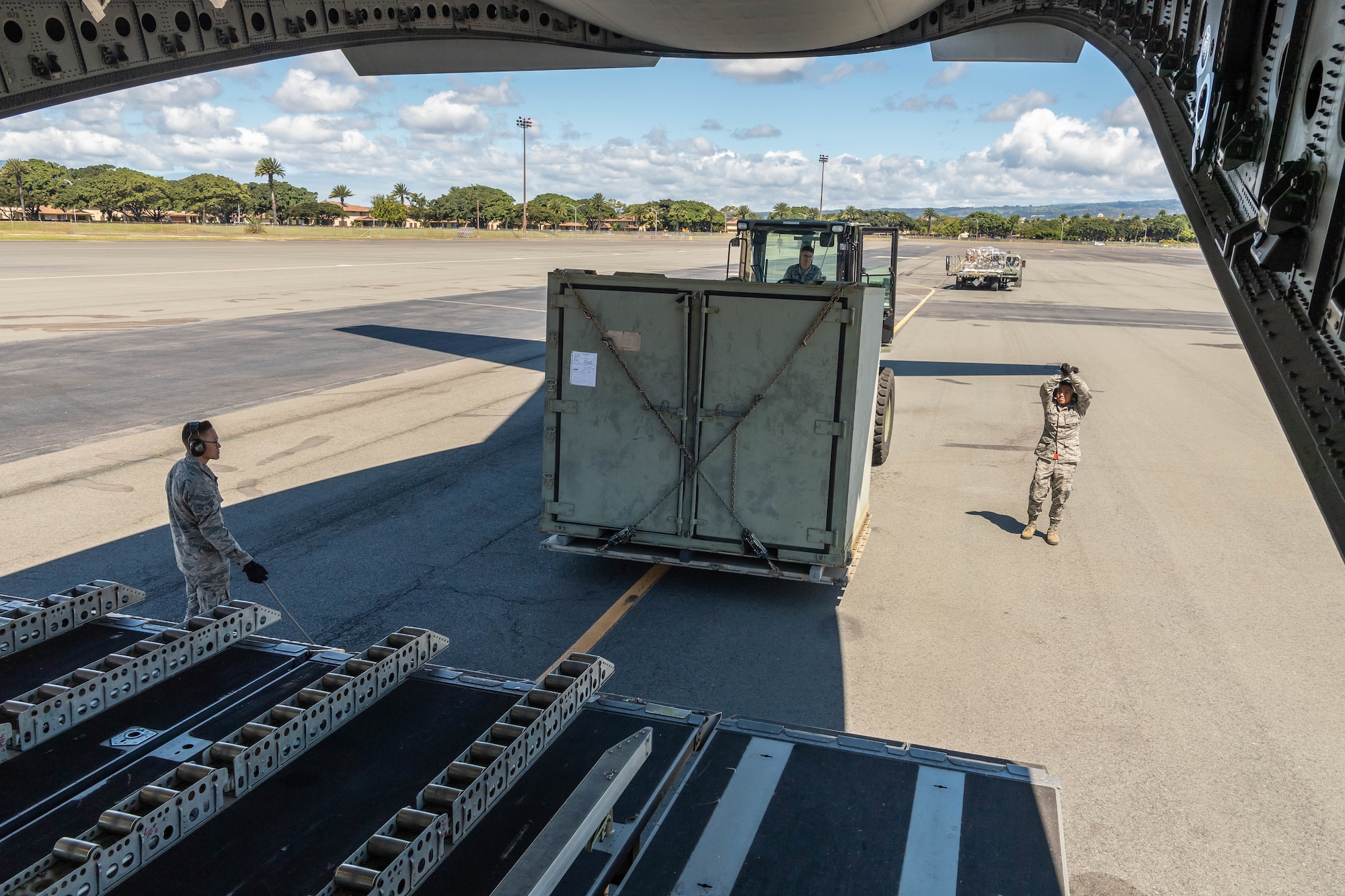 A team of Reserve Citizen Airmen from the 48th Aerial Port Squadron, load equipment onto a U.S. Air Force C-17 Globemaster III aircraft during an aeromedical staging and aerial port training at Joint Base Pearl Harbor-Hickam, Hawaii, March 3, 2019.