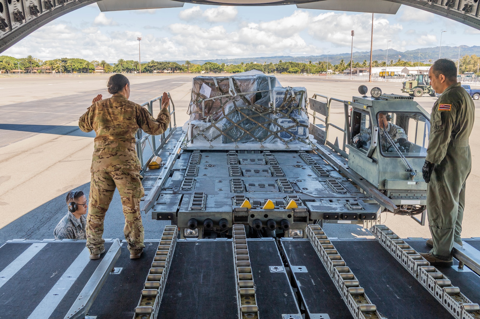 A team of Reserve Citizen Airmen from the 48th Aerial Port Squadron, load equipment onto a U.S. Air Force C-17 Globemaster III aircraft during an aeromedical staging and aerial port training at Joint Base Pearl Harbor-Hickam, Hawaii, March 3, 2019.