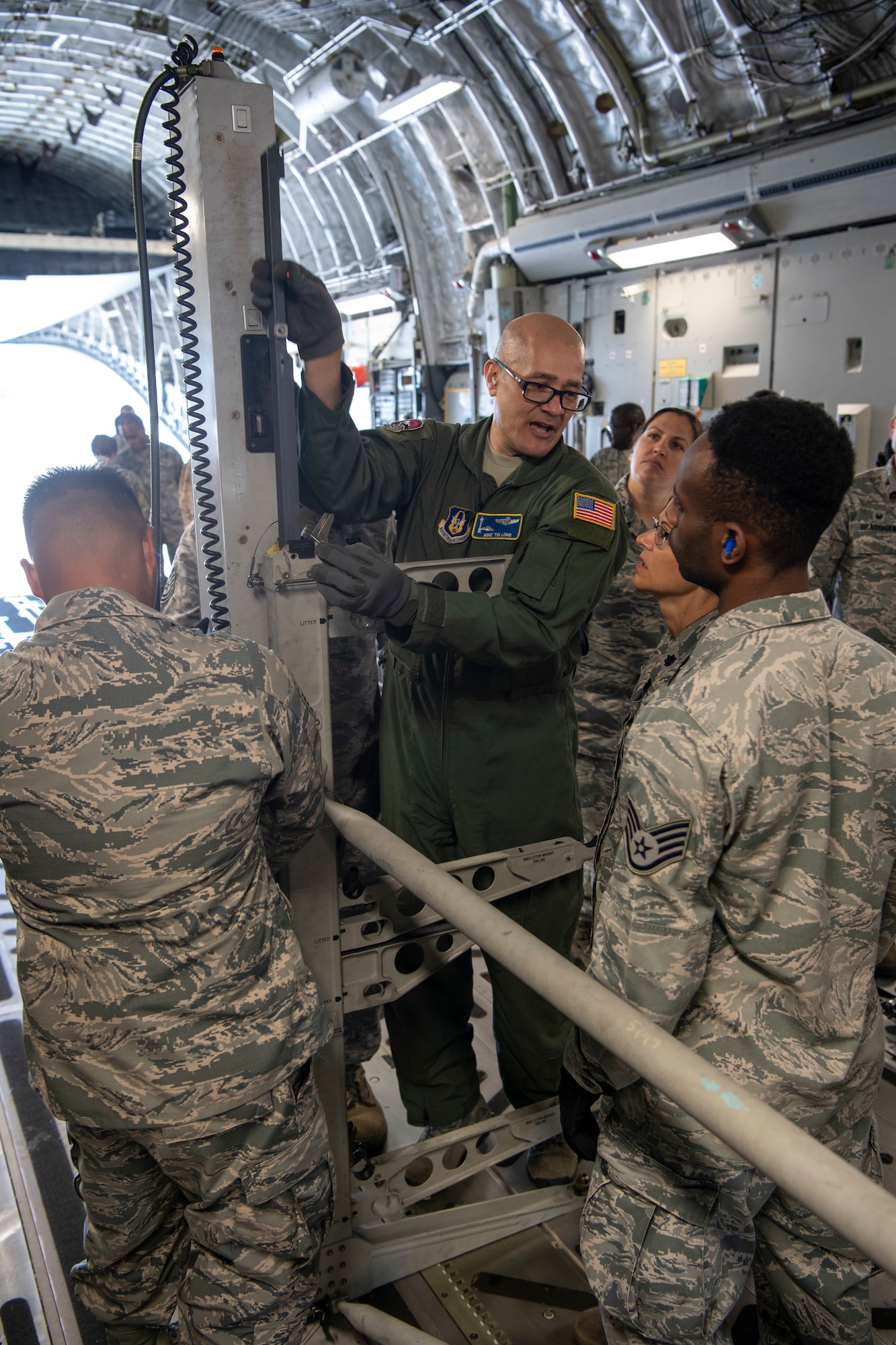 U.S. Air Force Master Sgt. Timmy Long, a loadmaster with the Air Force Reserve’s 313th Airlift Squadron, Joint Base Lewis-McChord, Washington, participates in a joint aeromedical staging and aerial port training at Joint Base Pearl Harbor-Hickam, Hawaii, March 3, 2019.