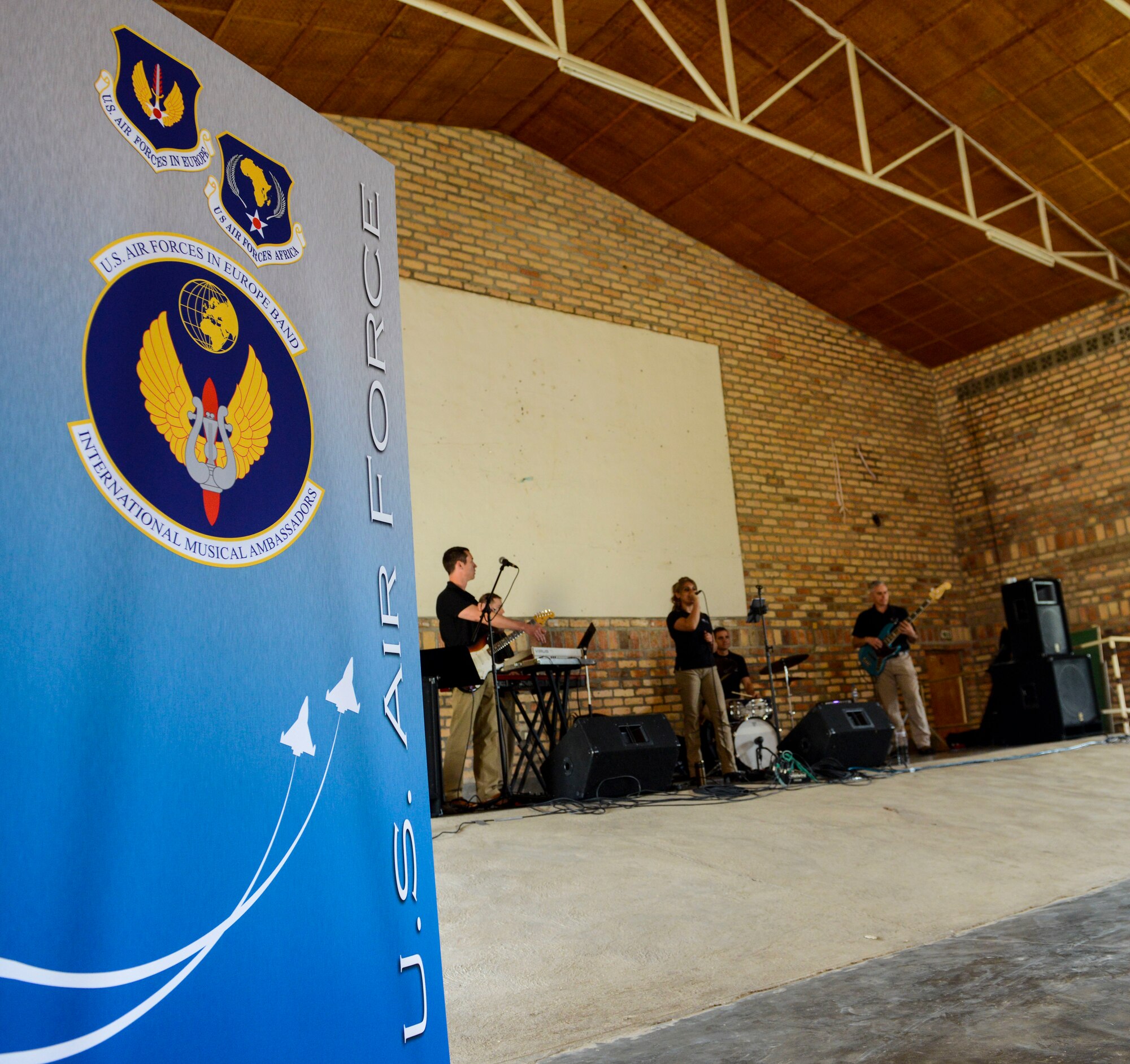U.S. Airmen assigned to the U.S. Air Forces in Europe Band Touch N' Go perform sound checks at the Home de la vierge des Pauvres Gatagara/Nyanza in the Nyanza District, Rwanda, March 5, 2019. The USAFE Band played for HVP Nyanza as part of an outreach event. The band uses these events to further increase cultural ties and enhance the people-to-people relationship between the United States and its partners such as Rwanda. (U.S. Air Forces photo by Tech. Sgt. Timothy Moore)