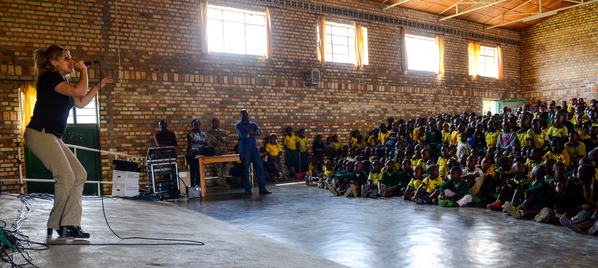 U.S. Air Force Senior Airman Linda Casul, U.S. Air Forces in Europe Band vocalist, performs for the students at the Home de la vierge des Pauvres Gatagara/Nyanza in the Nyanza District, Rwanda, March 5, 2019. The band uses these musical performance to further increase cultural ties and enhance the people-to-people relationship between the United States and and its partners such as Rwanda. (U.S. Air Forces photo by Tech. Sgt. Timothy Moore)