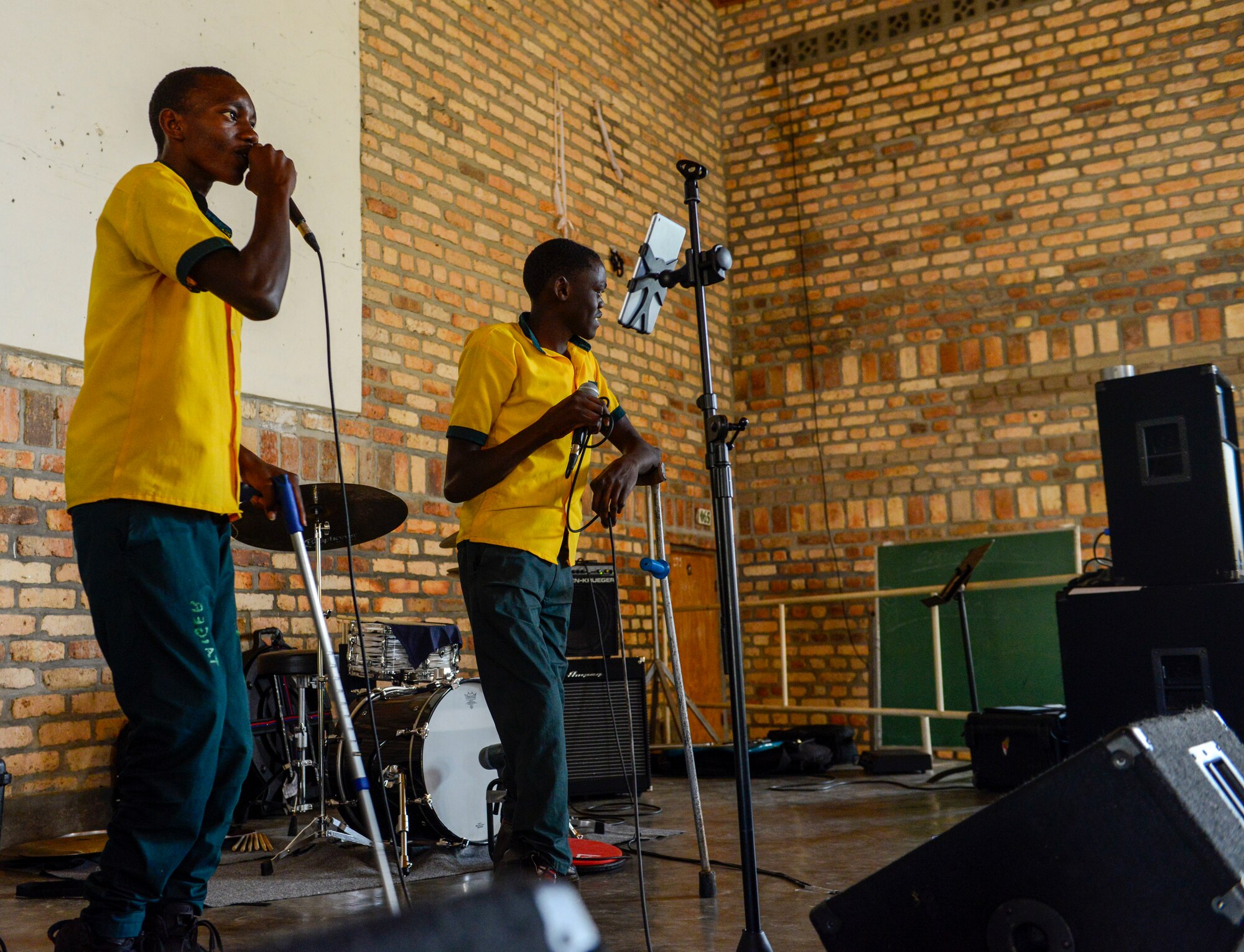 Students of the Home de la vierge des Pauvres Gatagara/Nyanza sing a song in the Nyanza District, Rwanda, March 5, 2019. The students wanted to sing a song after U.S. Airmen assigned to the U.S. Air Forces in Europe Band Touch N' Go played a concert. Part of HVP Nyanza's mission is to educate and reintegrate children with disabilities as productive members of their respective societies. It's motto is "Enable the disabled. Translate disability into ability." (U.S. Air Force photo by Tech. Sgt. Timothy Moore)