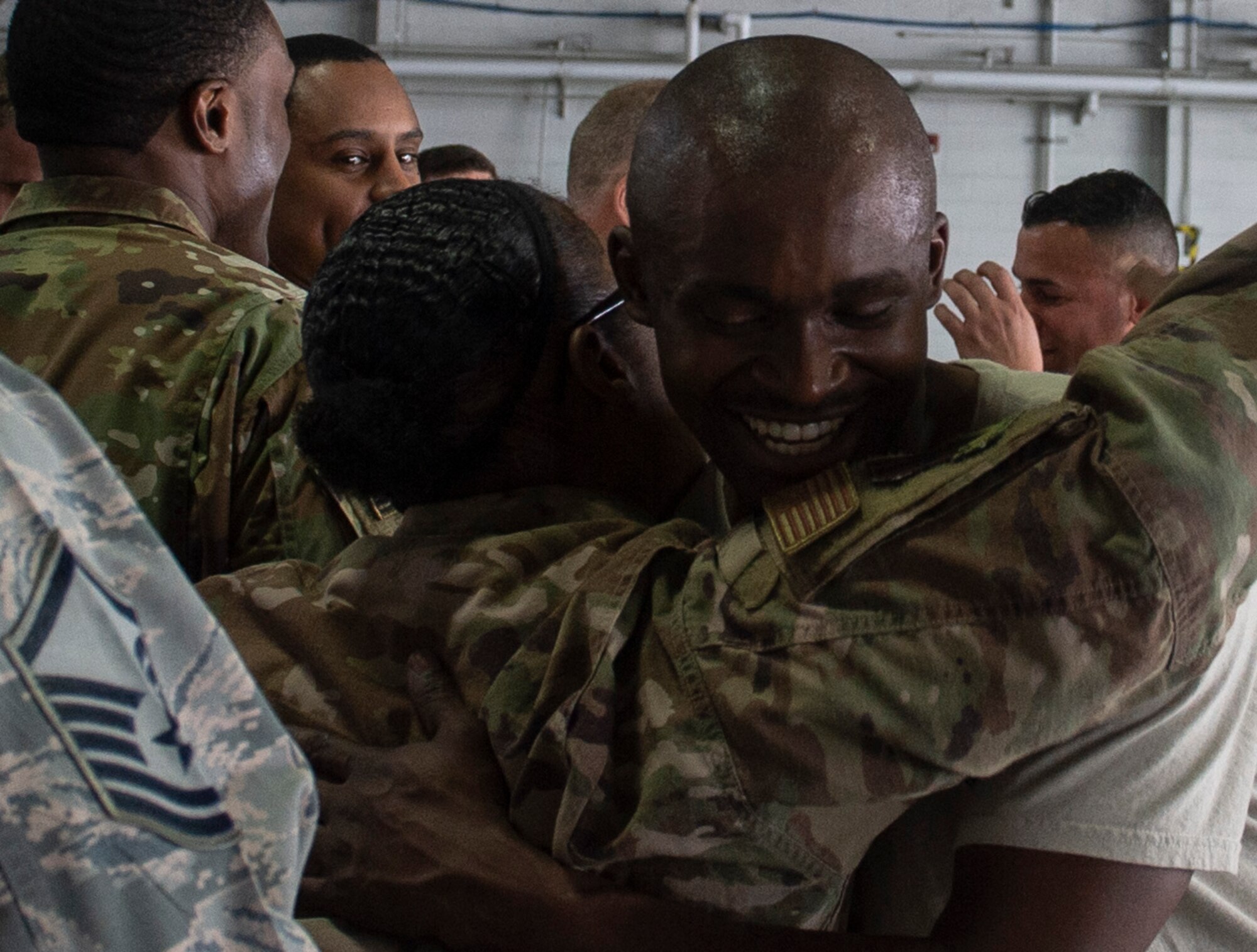 U.S. Air Force Senior Airman Josef Thompson, 20th Aircraft Maintenance Squadron, 77th Aircraft Maintenance Unit load crew member, embraces a wingman following the completion of the Load Crew of the Year competition at Shaw Air Force Base, S.C., March 1, 2019.