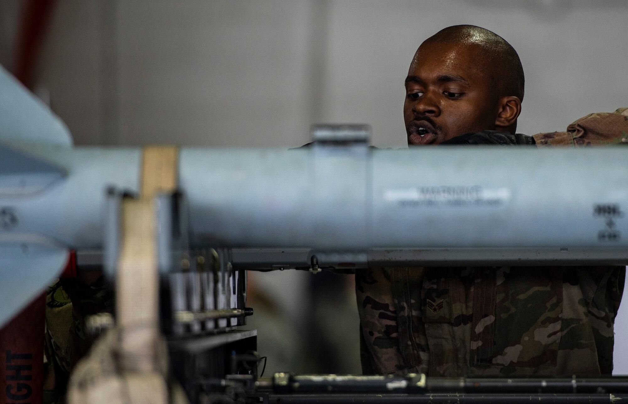 U.S. Air Force Senior Airman Josef Thompson, 20th Aircraft Maintenance Squadron, 77th Aircraft Maintenance Unit load crew member, inspects an AIM-9X Sidewinder at Shaw Air Force Base, S.C., March 1, 2019.