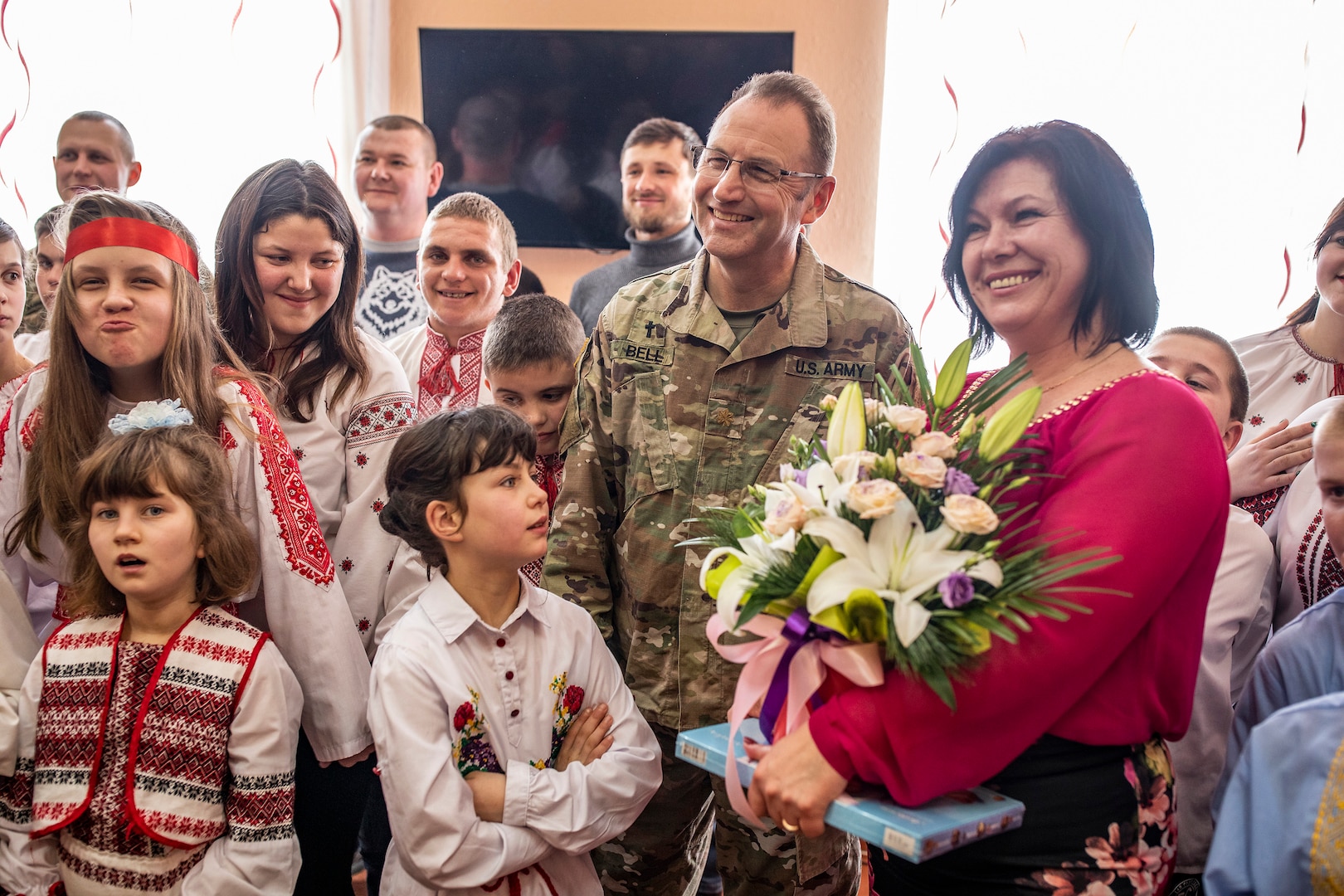 Maj. Terry Bell from the Tennessee Army National Guard stands with the director of the Rehabilitation Center for the Children of Special Needs, Natalia Frankiv during a visit to the orphanage in Krakovets, Ukraine, March 4, 2019.