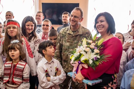 Maj. Terry Bell from the Tennessee Army National Guard stands with the director of the Rehabilitation Center for the Children of Special Needs, Natalia Frankiv during a visit to the orphanage in Krakovets, Ukraine, March 4, 2019.