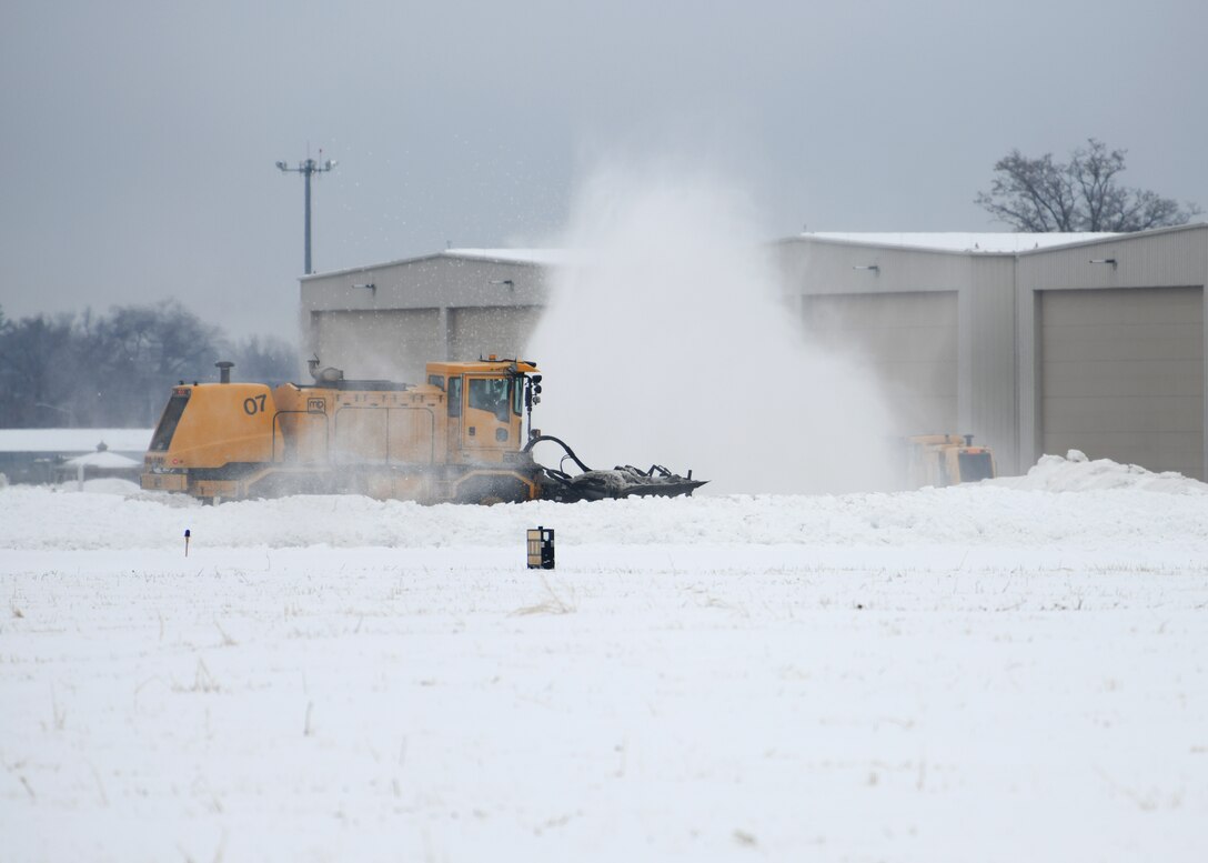 The 104th Civil Engineering Squadron Snow Removal Team clears the runway, sidewalks and driving areas after a winter storm Feb. 13, 2019, at Barnes Air National Guard Base, Massachusetts. The snow removal team's timely response to storms ensures the 104th Fighter Wing is mission ready regardless of weather conditions. (U.S. Air National Guard photo by Airman 1st Class Randy Burlingame)