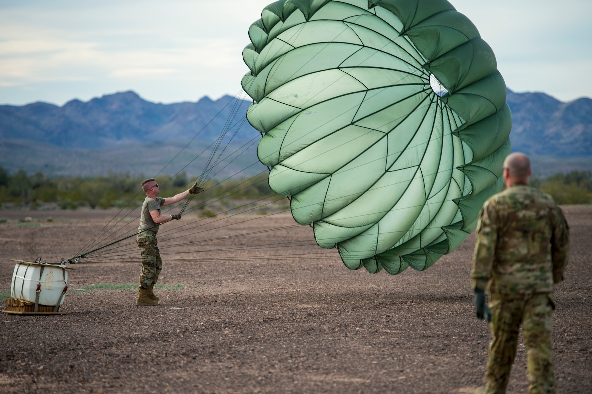 U.S. Air Force Staff Sgt. Nicholas Warren, an air transportation specialist with the 133rd Logistics Readiness Squadron, recovers Low Cost Low Altitude (LCLA) equipment after an airdrop mission at the Yuma Proving Grounds, Ariz. Feb. 26, 2019.