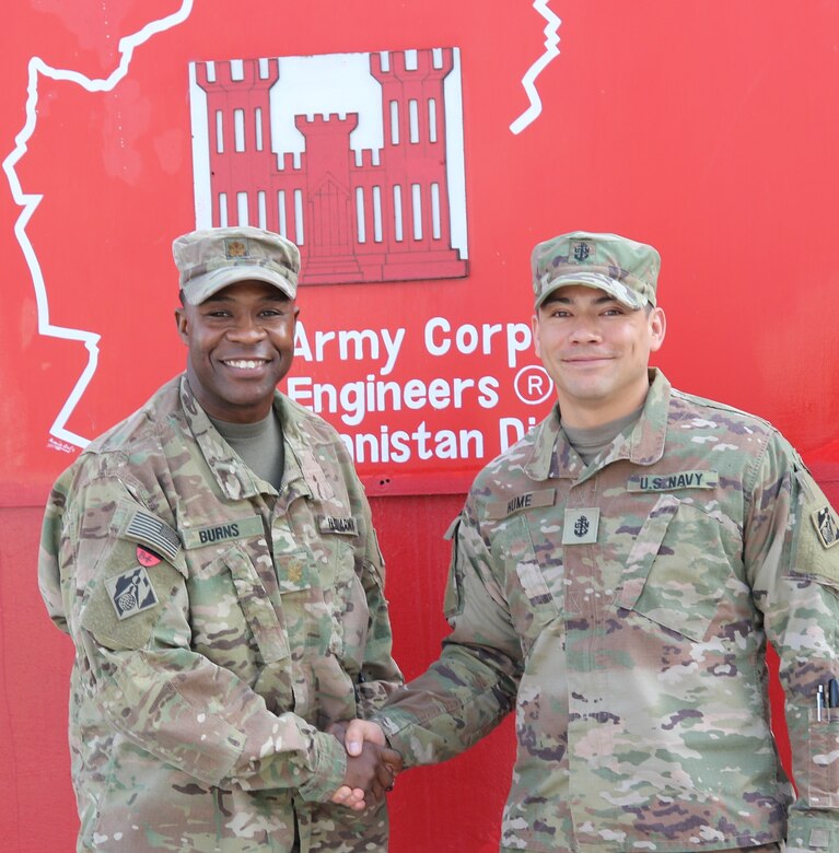 As outgoing FEST OIC shakes the hand of incoming FEST NCOIC, he just couldn't resist shouting out Go Army! Beat Navy!