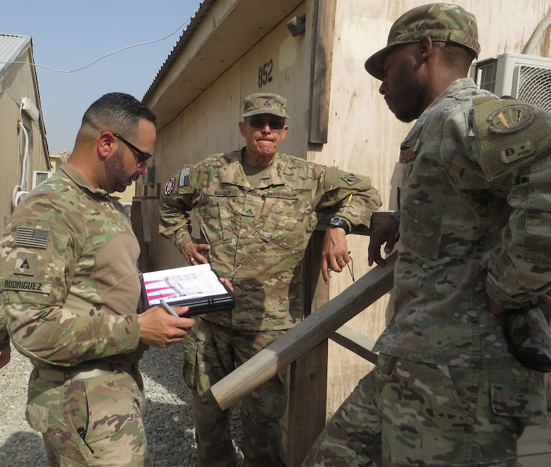 Prior to heading out to complete a task the 565th FEST team gathers their facts and way forward.