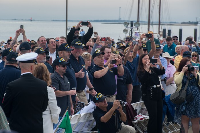 Crewmembers from the USS Charleston (LKA-113), an amphibious Navy cargo ship commissioned in 1968, take pictures of members from the new USS Charleston (LCS-18) at the ship’s commissioning ceremony March 2, 2019, in Charleston, S.C.