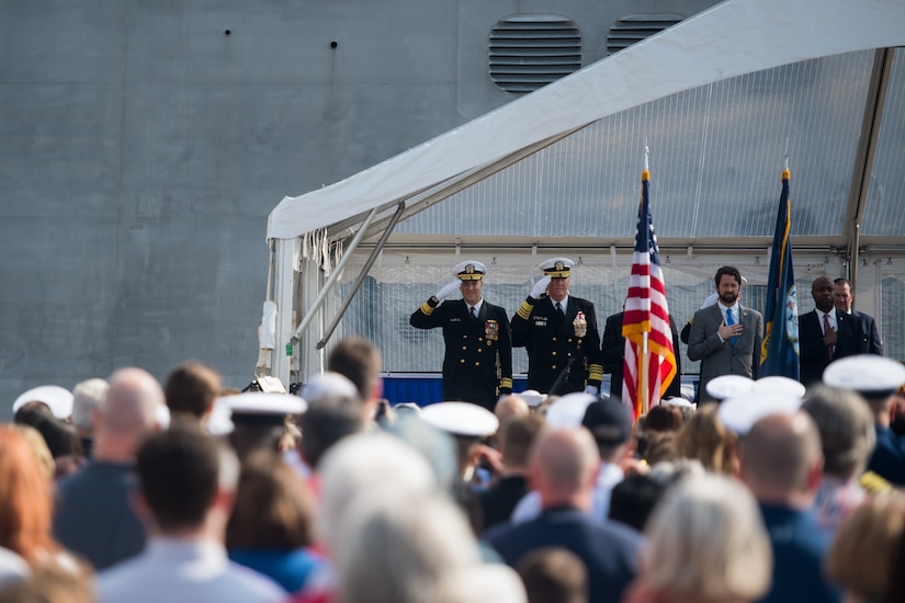 Members of the official party salute the colors at the USS Charleston (LCS-18) commissioning ceremony March 2, 2019, in Charleston, S.C.