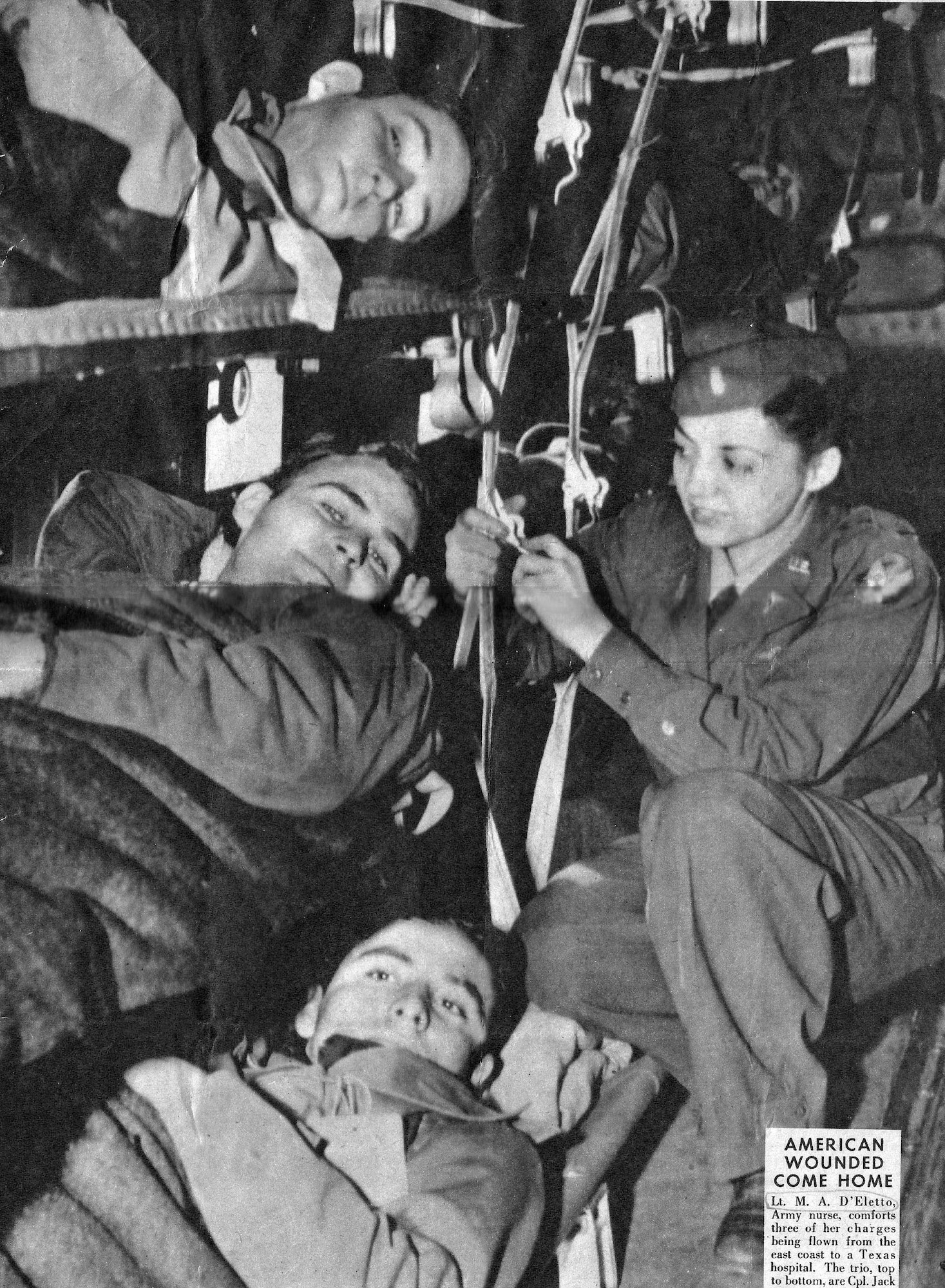 U.S. Army Air Corps flight nurse 1st Lt. Madeline “Del” D’Eletto comforts three wounded soldiers on a flight from the east coast of the U.S. to a Texas hospital. (Courtesy photo by Madeline D’Eletto)