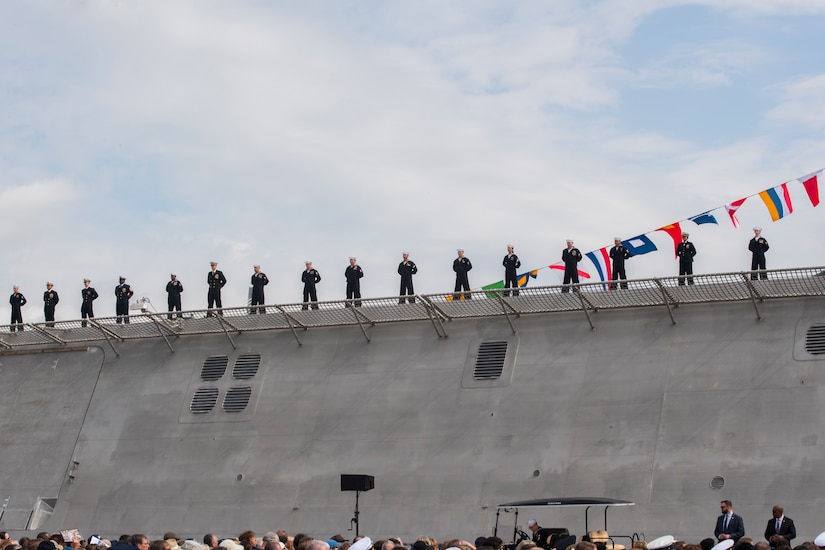 Crew members of the USS Charleston (LCS-18) officially man the ship for the first time at its commissioning ceremony March 2, 2019, in Charleston, S.C.