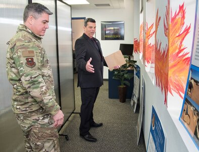 Sean Harrington, Air Education and Training Command Innovation Advancement Division lead, highlights the capabilities of the "Fire Pit" to Col. Jason Lamb, AETC's Director of Intelligence, Analysis, and Innovation March 5 at Joint Base San Antonio-Randolph. Mirrored to the wing level Spark Cell variant, the "Fire Pit" is AETC’s effort to invigorate innovation and support grassroots initiatives in a collaborative space designed to incubate and accelerate innovation initiatives and build a network with industry, academia, and the Department of Defense to provide rapid solutions to the needs of the warfighter.