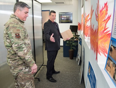 Sean Harrington, Air Education and Training Command Innovation Advancement Division lead, highlights the capabilities of the "Fire Pit" to Col. Jason Lamb, AETC's Director of Intelligence, Analysis, and Innovation, March 5, 2019, at Joint Base San Antonio-Randolph, Texas. Mirrored to the wing level Spark Cell variant, the "Fire Pit" is AETC’s effort to invigorate innovation and support grassroots initiatives in a collaborative space designed to incubate and accelerate innovation initiatives and build a network with industry, academia, and the Department of Defense to provide rapid solutions to the needs of the warfighter.