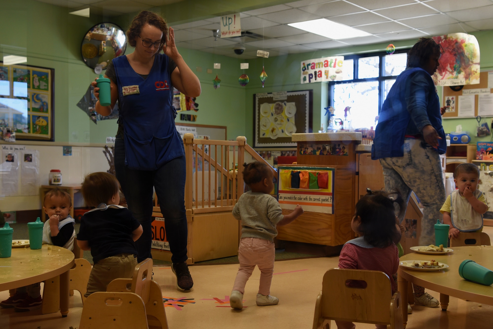 Children and 20th Force Support Squadron Child Development Center (CDC) caregivers clean up after lunch at the CDC at Shaw Air Force Base, S.C., Feb. 25, 2019.