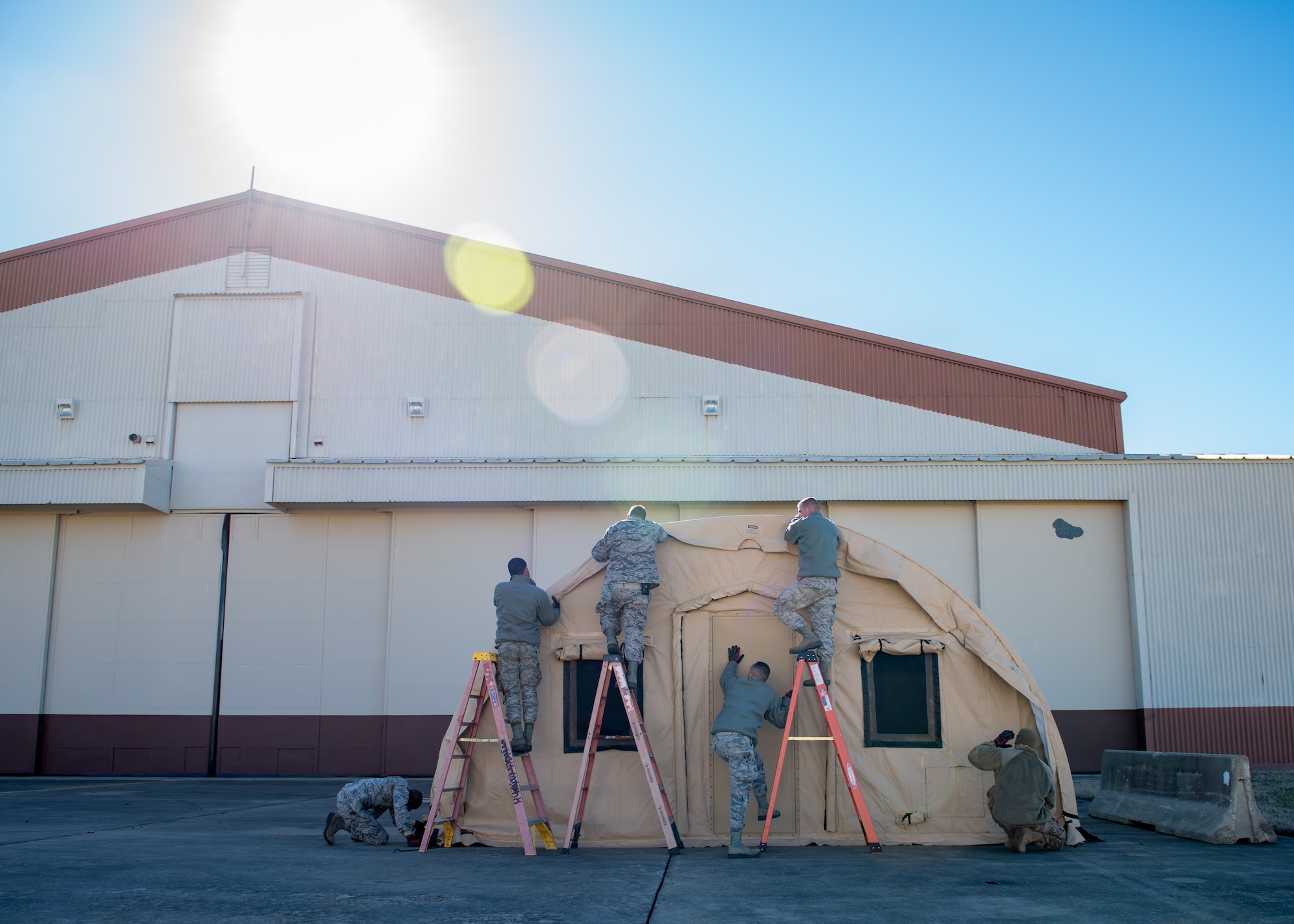 U.S. Air Force Airmen from the 633rd Civil Engineering Squadron build a tent during a total force exercise at Joint Base Langley-Eustis, Virginia, Feb. 25, 2019.