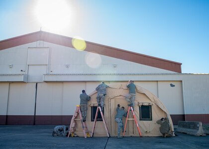 U.S. Air Force Airmen from the 633rd Civil Engineering Squadron build a tent during a total force exercise at Joint Base Langley-Eustis, Virginia, Feb. 25, 2019.