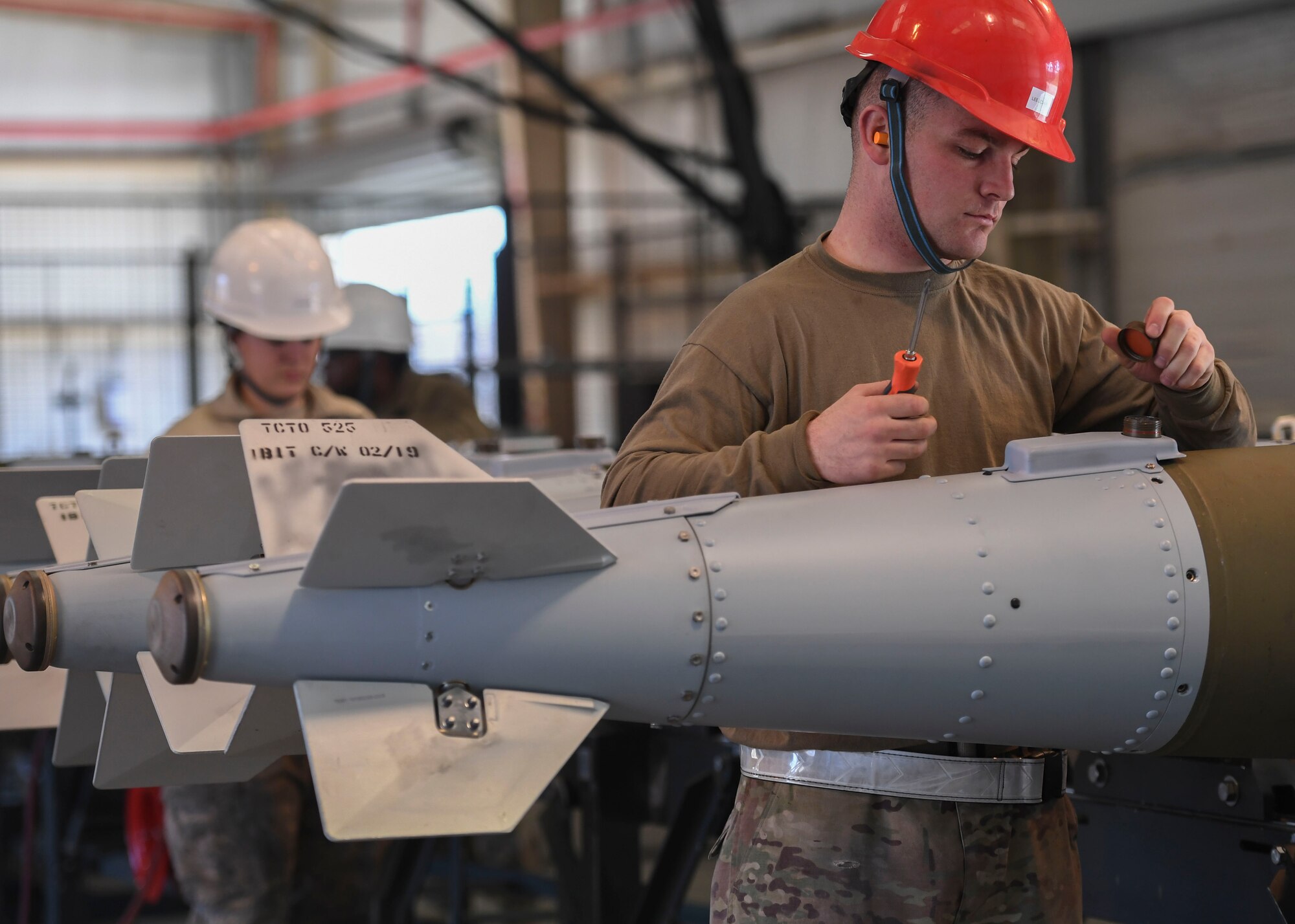 U.S. Air Force Airmen from the 1st Aircraft Maintenance Squadron’s munitions flight prepare inert GBU-32s during a total force exercise at Joint Base Langley-Eustis, Virginia, Feb. 26, 2019.