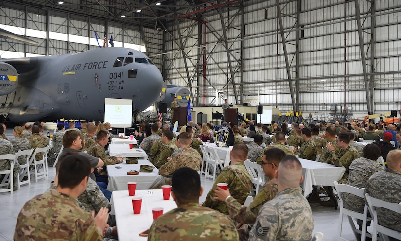 Airmen, civilians and family members listen to opening remarks at the 437th Airlift Wing Annual Awards Ceremony March 1, 2019, at Joint Base Charleston, S.C.