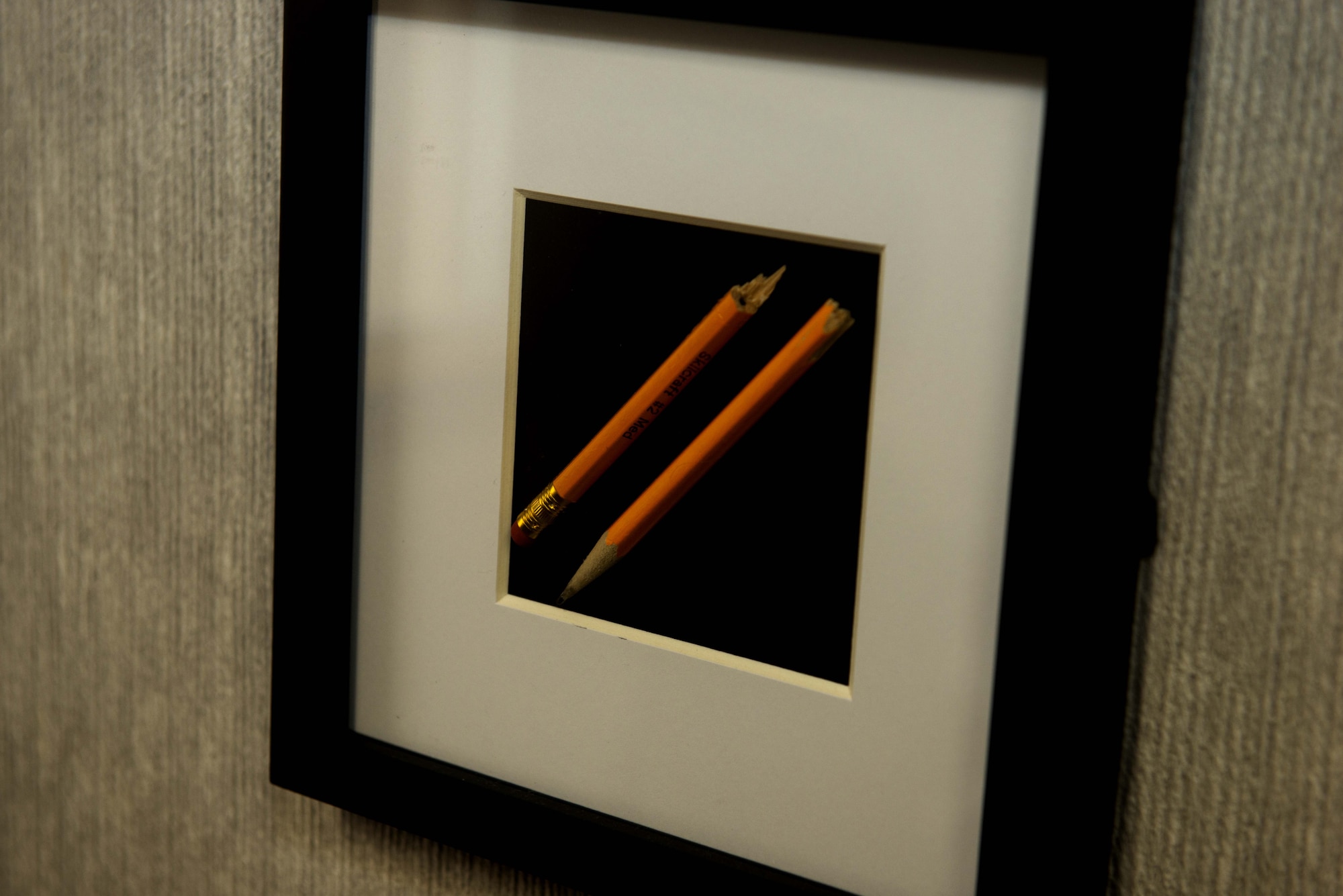 A framed broken pencil from the first case U.S. Air Force Captain Joshua Joyce, Air Force Legal Operations Agency (AFLOA) Area Defense Counsel (ADC), won is displayed on his office wall, at Shaw Air Force Base, S.C., March 1, 2019.