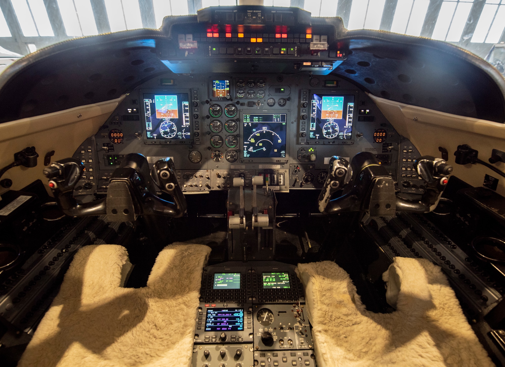 The 458th Airlift Squadron displays its new $38 million avionics upgrade to the C-21 at Scott Air Force Base, Illinois. The new avionics and communications suites expand the aircraft’s reach, effectiveness, and capability, and come in time to meet Federal Aviation Administration’s 2020 equipment mandate to keep increasingly congested airspace safe.  (U.S. Air Force photo by Senior Airman Tara Stetler)