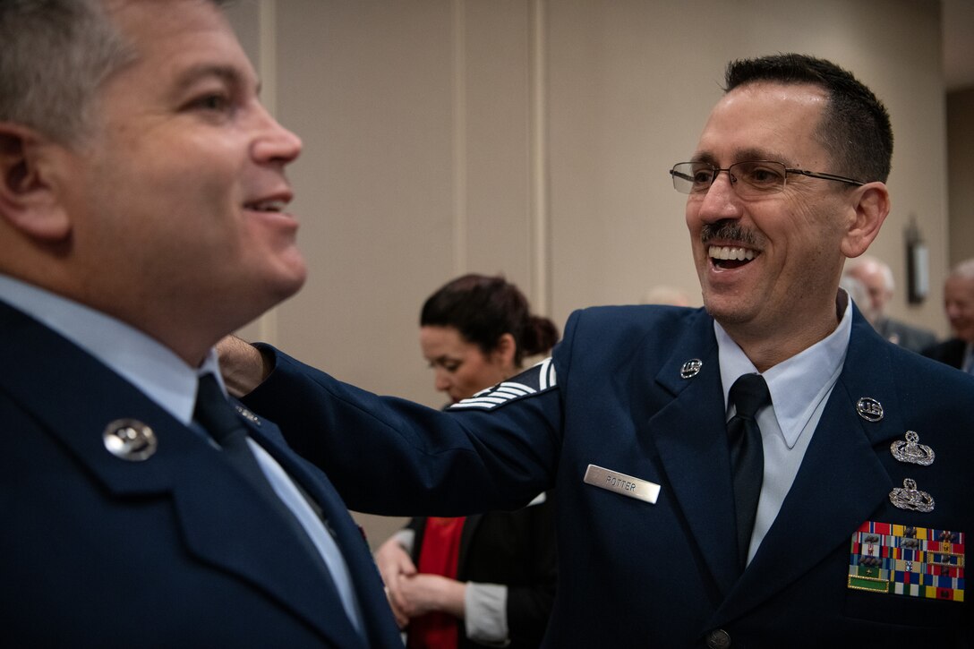 Oklahoma Air National Guard Chief Master Sgt. Anthony Potter (right), senior enlisted manager assigned to the 205th Engineering and Installation Squadron (205th EIS) at Will Rogers Air National Guard Base, Oklahoma City, shares a laught with Oklahoma Air National Guard Master Sgt. Bryan Whittle, also assigned to the 205th EIS, after the American Red Cross of Oklahoma honored Whittle as their military hero of the year during the 2019 Heroes Breakfast in Oklahoma City, March 5, 2019. Whittle was one of eight people honored for actions in six categories – including military, first responder, healthcare professional, community impact, disaster services and youth – during the first ever Red Cross Heroes Breakfast in Oklahoma City. (U.S. Air National Guard Photo by Tech. Sgt. Kasey M. Phipps)