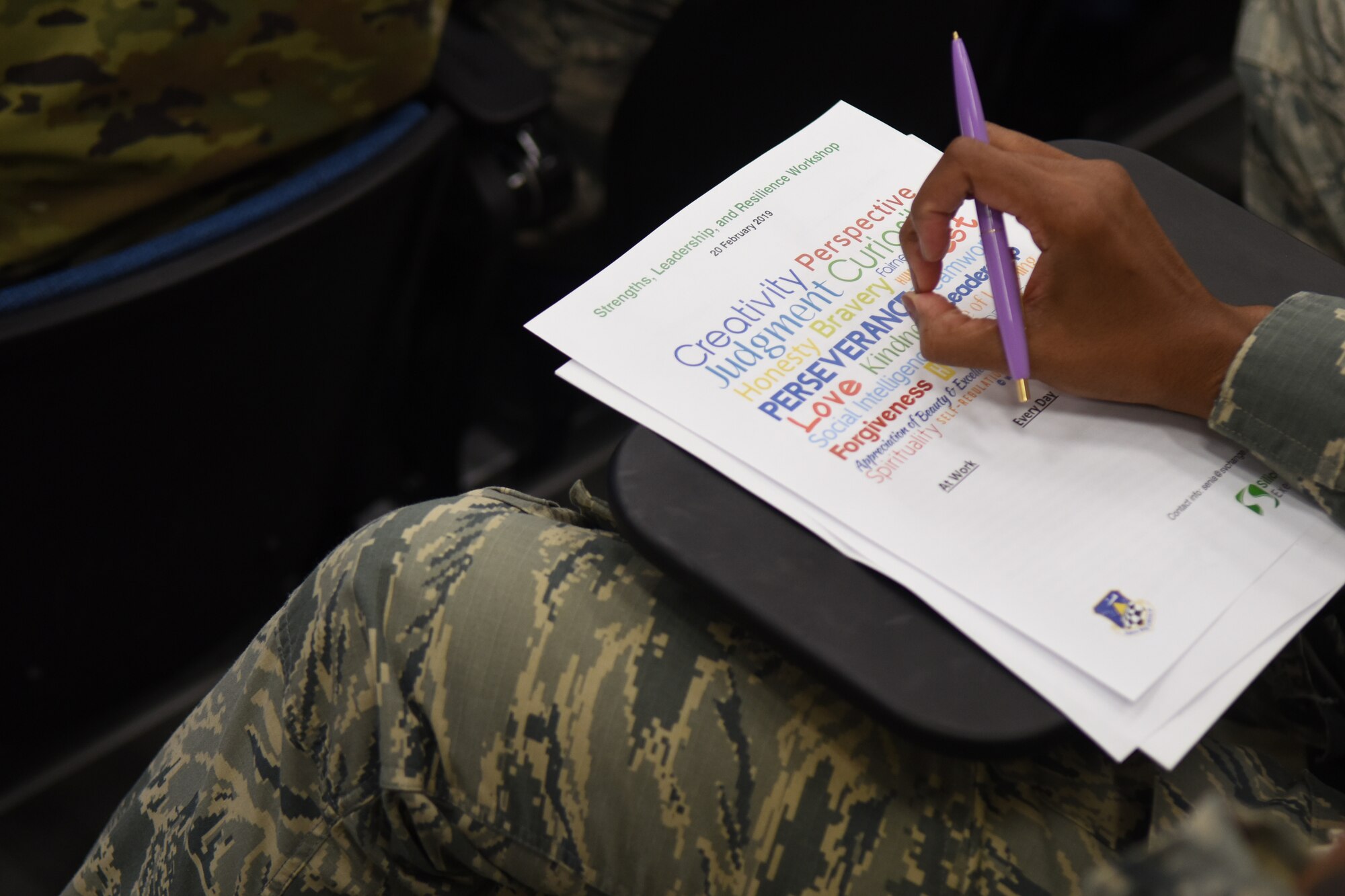 An Airman from the 9th Intelligence Squadron reviews a word cloud during the Strengths, Leadership, and Resilience Workshop