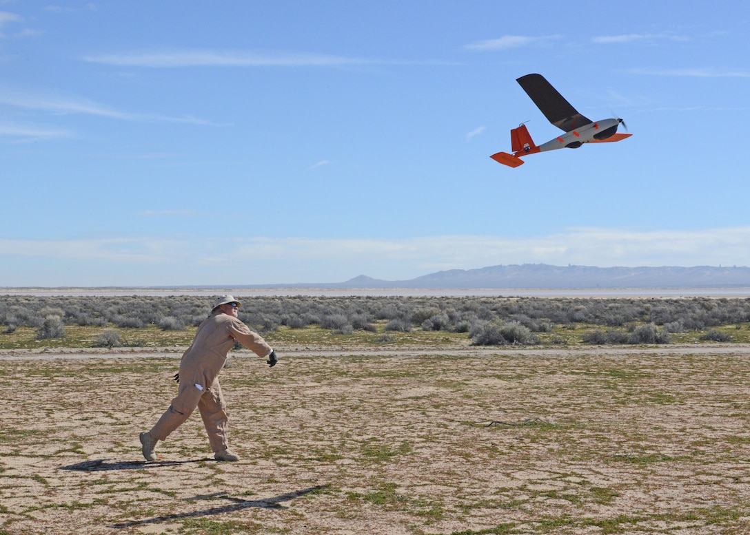 David Freeman, 412th Test Wing Emerging Technologies Combined Test Force, hand launches a small unmanned aircraft system in the north part of Edwards Air Force Base, California, Feb. 27. The ET CTF conducted its first autonomy flight test Feb. 26-27. (U.S. Air Force photo by Kenji Thuloweit)
