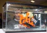 Patronis Elementary School Robotics League Student operates an underwater robot during Naval Surface Warfare Center Panama City Division’s (NSWC PCD) inaugural STEMinar event March 6. The long term goal for STEM Outreach at NSWC PCD is to make it clear that NSWC PCD is the employer of choice in the area.