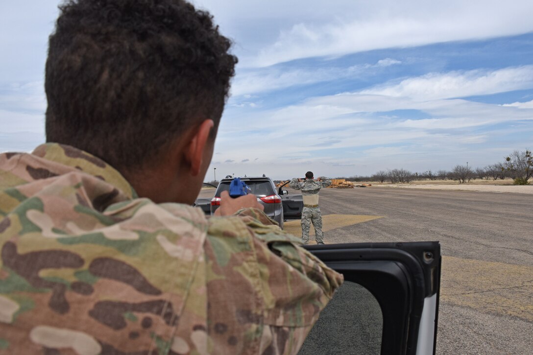 Members from the 17th Security Forces Squadron practice high risk traffic stops during the tactical driving exercise on Goodfellow Air Force Base, Texas, Feb. 27, 2019. The course was designed to help members be prepared for any situation that may arise on base. (U.S. Air Force photo by Senior Airman Seraiah Hines/Released)