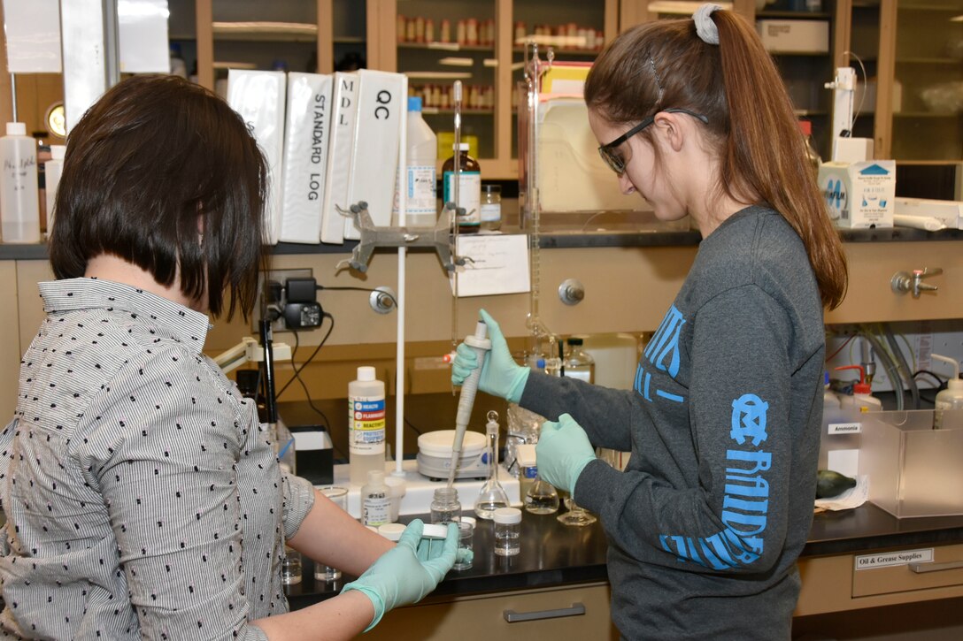 Moore County High School student Bailey Frazier, right, mixes chemicals in the Arnold Air Force Base Chemical and Metallurgical Lab while Lena Elenchin, a chemical analyst at Arnold, looks on. Frazier and other area high school students interested in engineering as a possible future career took part in the Engineer for a Day event Feb. 20 at Arnold. (U.S. Air Force photos by Bradley Hicks)