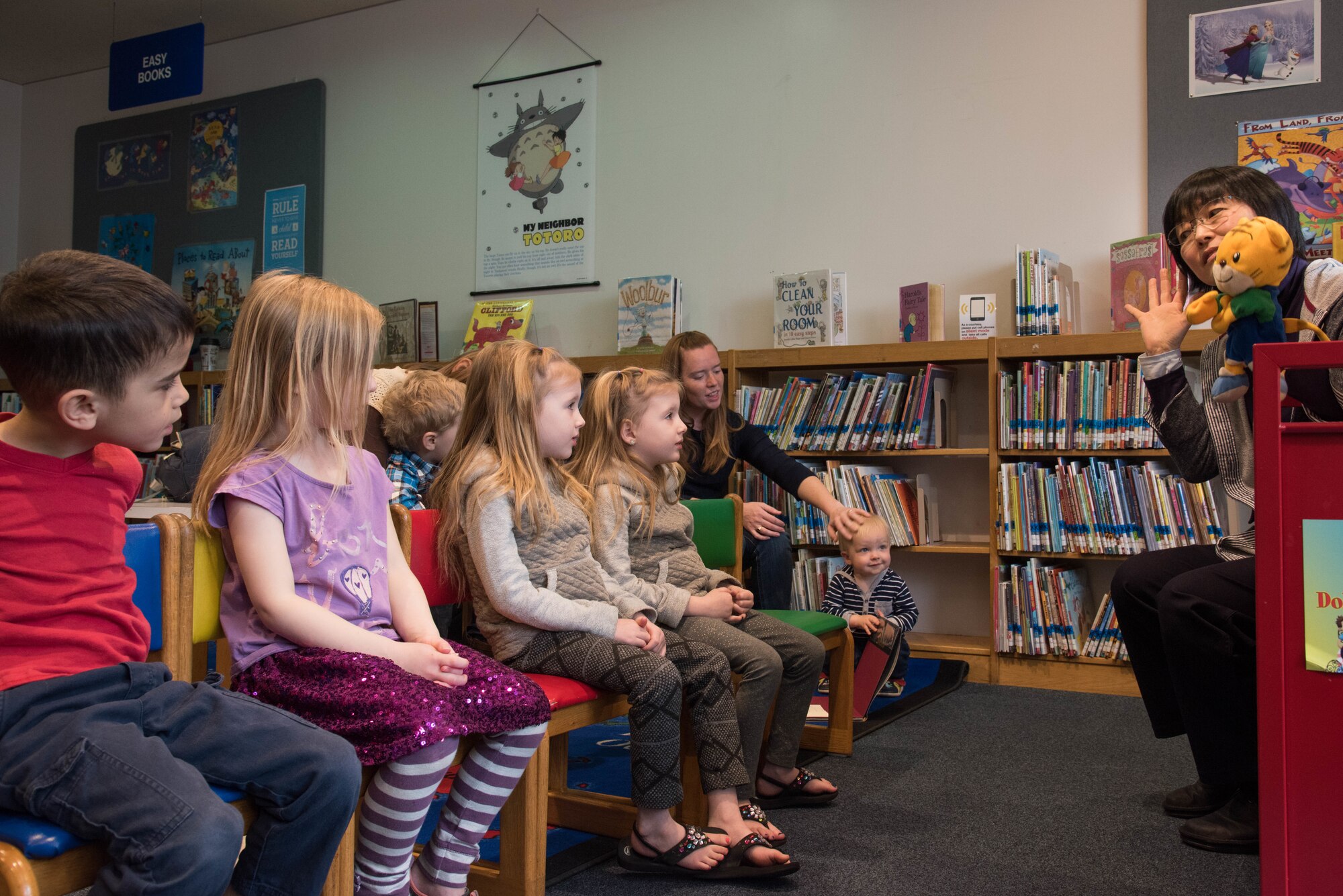 Michiko Wada, Japanese story time instructor, sings along with a puppet during Japanese story time at Yokota Air Base, Japan, Feb. 25, 2019.